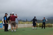 Putting on the practice green at Mid Pacific Country Club