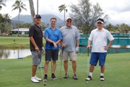 Golfers pose for their group shot at the par 3 in Lanikai