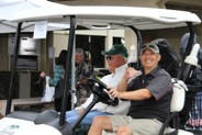 Ready to tee off! Looking good in their golf cart!