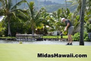 Golfer takes his swing at the Midas Hawaii APIII Memorial Golf Tournament
