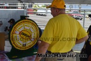 Spin to win at the Drive Out Hunger Kickoff Event Midas Hawaii Oil Change Auto Repair 015