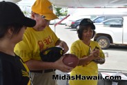 Football challenge to get it in the tire at the Drive Out Hunger Kickoff Event Midas Hawaii Oil Change Auto Repair 026
