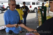 Lots of prizes given away at the Drive Out Hunger Kickoff Event Midas Hawaii Oil Change Auto Repair 053