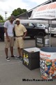 Our first visitors donating canned goods at the Drive Out Hunger Kickoff Event Midas Hawaii Oil Change Auto Repair 169