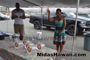 Tough challenge but she did it at the Drive Out Hunger Kickoff Event Midas Hawaii Oil Change Auto Repair 177