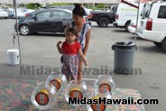 Trying her skills at the Drive Out Hunger Kickoff Event Midas Hawaii Oil Change Auto Repair 185